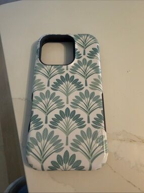 Casely Iphone 16 pro Phone Case with Teal Botanical Pattern - White and Teal